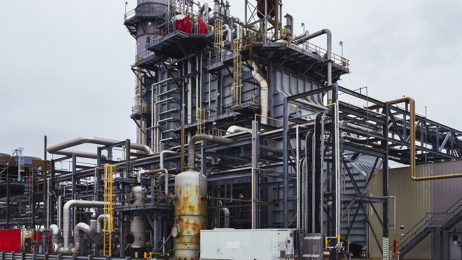 Industrial generation plant with gas and process piping.