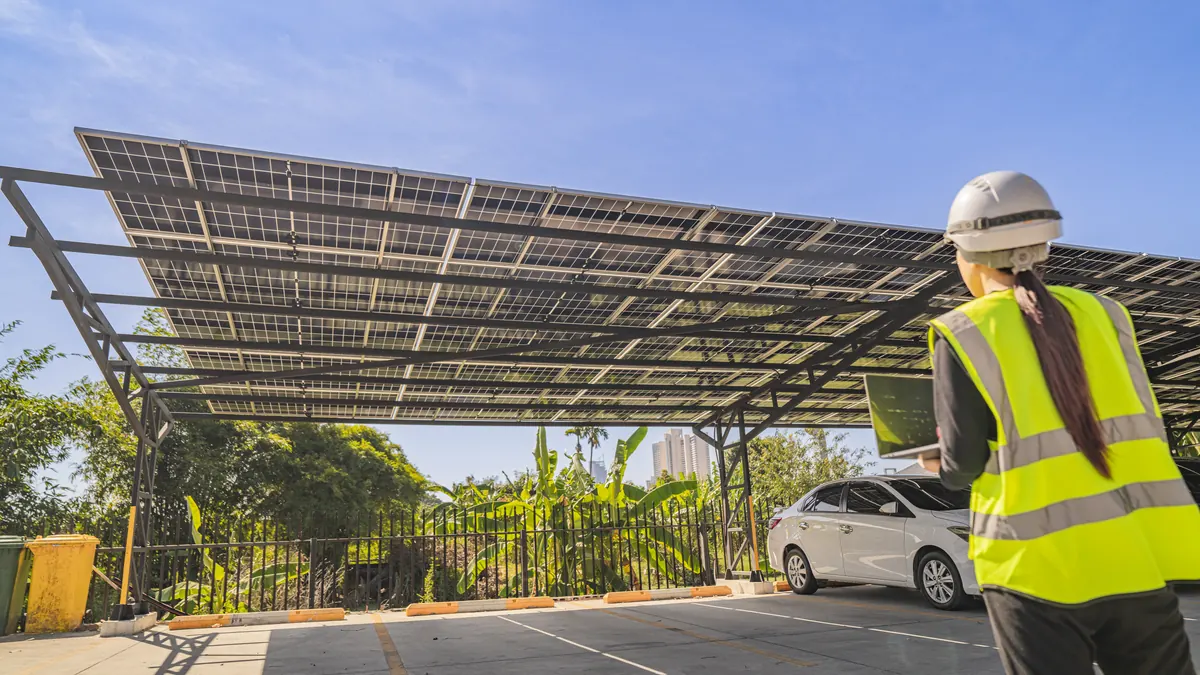 Engineer inspects a solar carport.