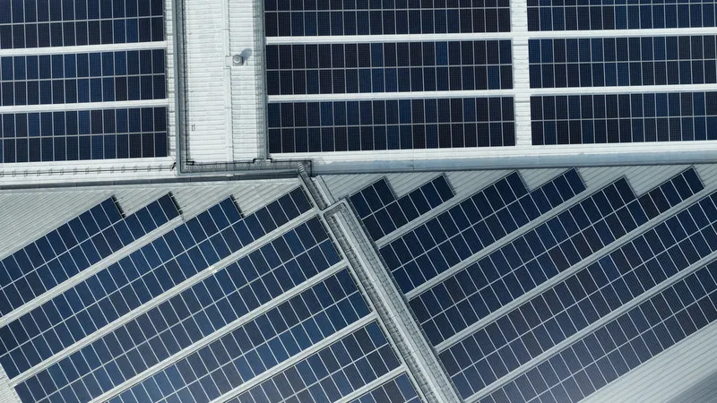 Solar panels on the roof of an industrial building.